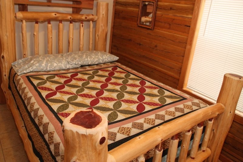 Custom  cedar log queen bed frame and country quilt 