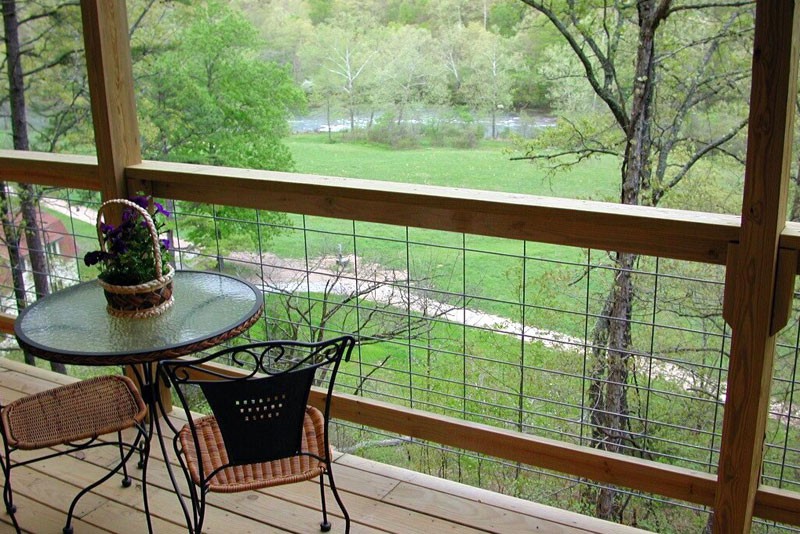 River view from the covered deck of the tree house cabin